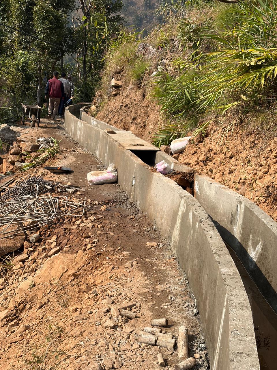 Concrete-lined irrigation canal under construction