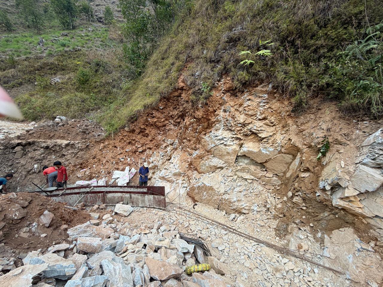 Construction works at a rocky hillside cut