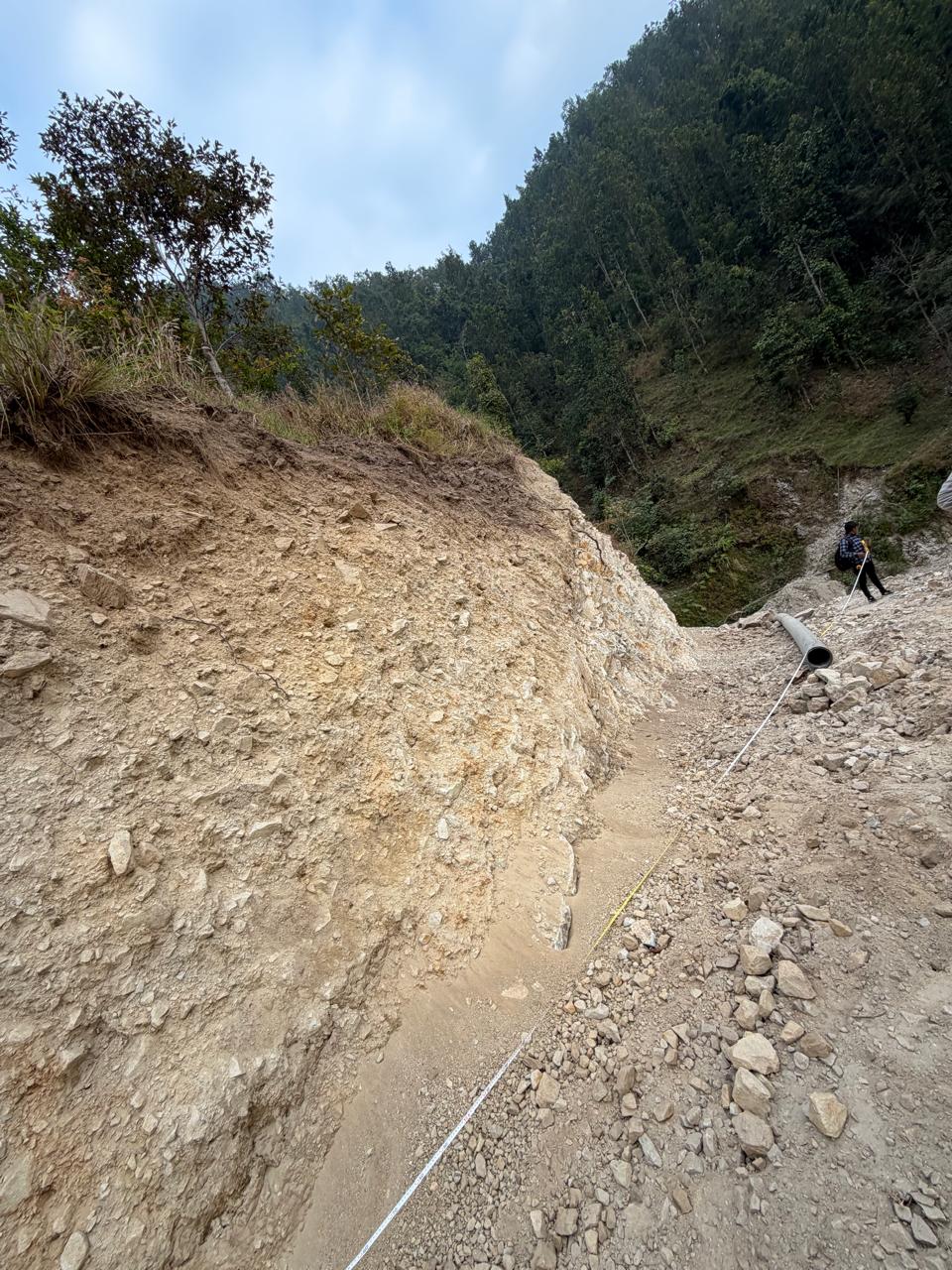 Pipeline alignment and excavation through steep terrain