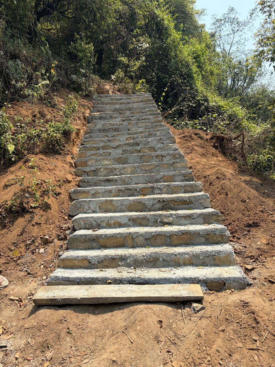Newly constructed concrete and stone stairs