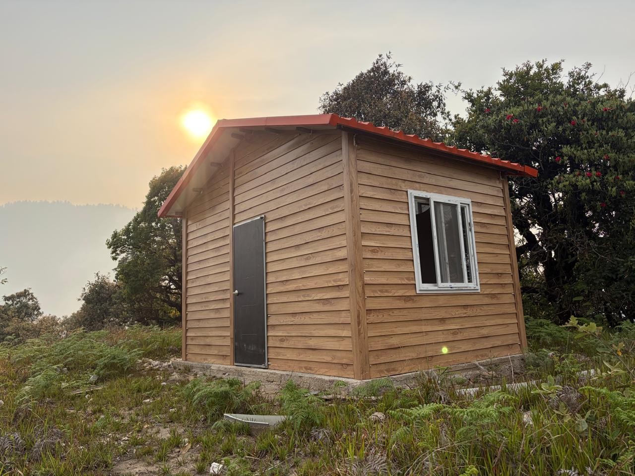 Timber-clad rest house with truss roof
